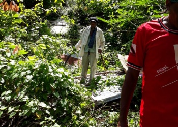 Br. Yusuf Ali stands on what remains of the Roof